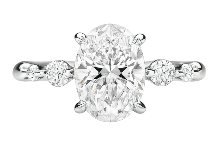 Oval diamond ring set with smaller round diamonds | undefined