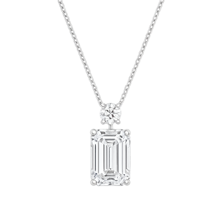 Emerald Cut Diamond Pendant set with a small round diamond with a chain | Hero.png