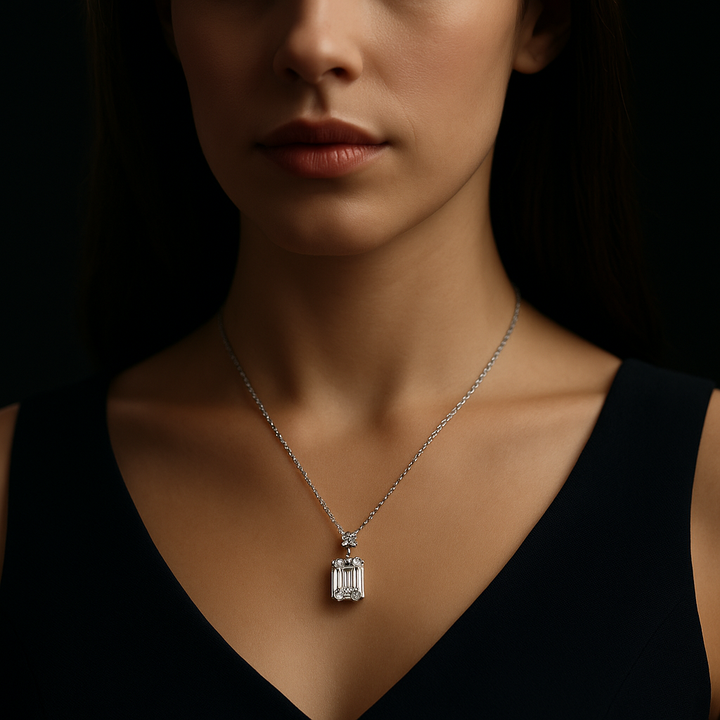 Emerald Cut Diamond Pendant set with a small round diamond with a chain | Hero